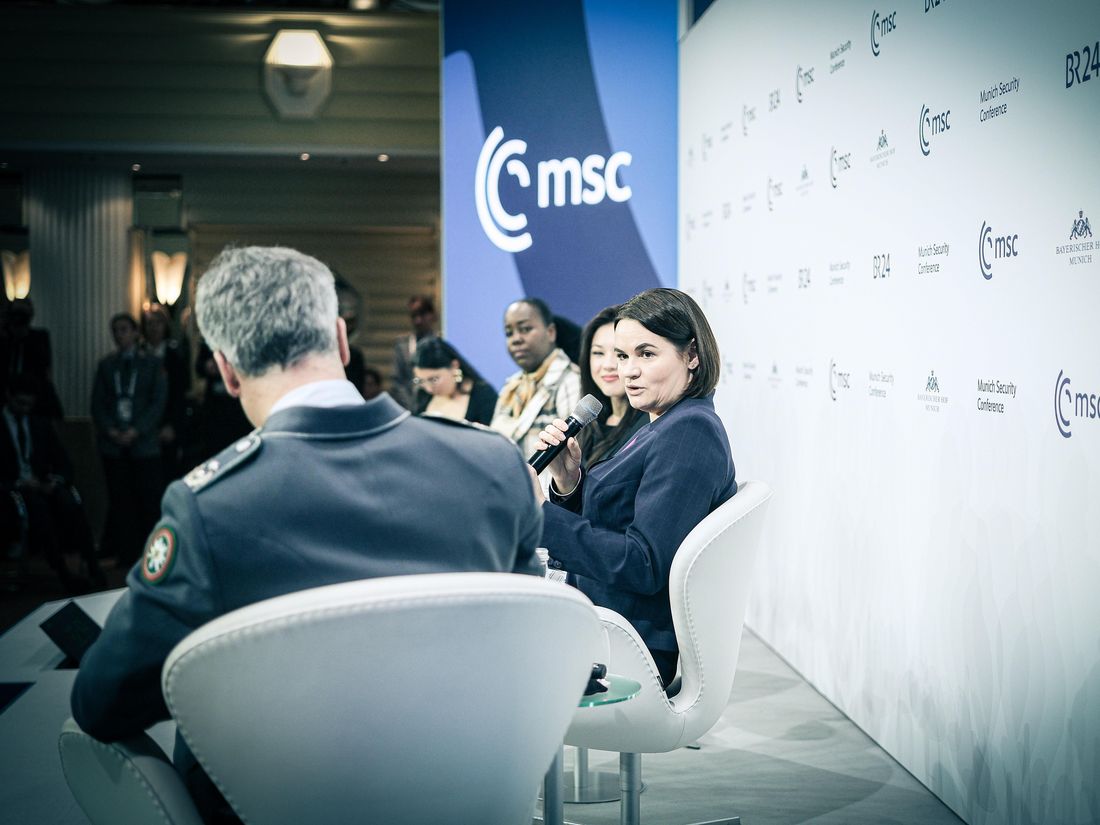 Sviatlana Tsikhanouskaya speaking on a panel at the Munich Security Conference 2025 to other participants.